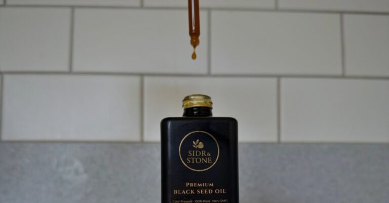 What are the 10 benefits of black seed oil proven by science. a black seed oil bottle