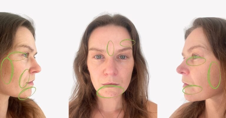 Woman with long hair, neutral expression.