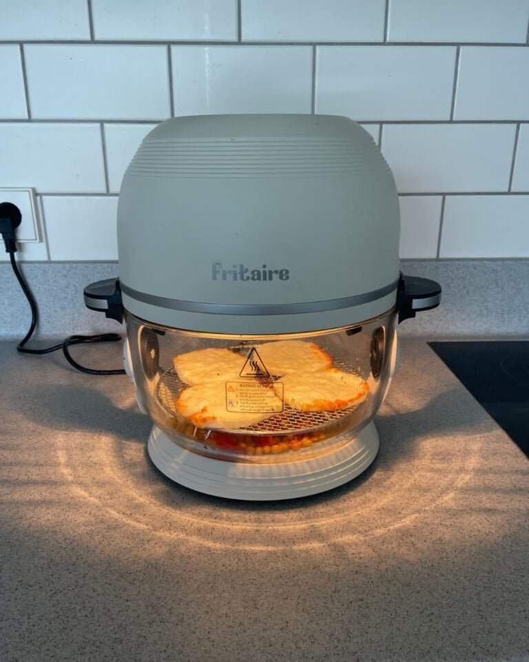 fritaire airfryer on a kithen counter cooking cheese